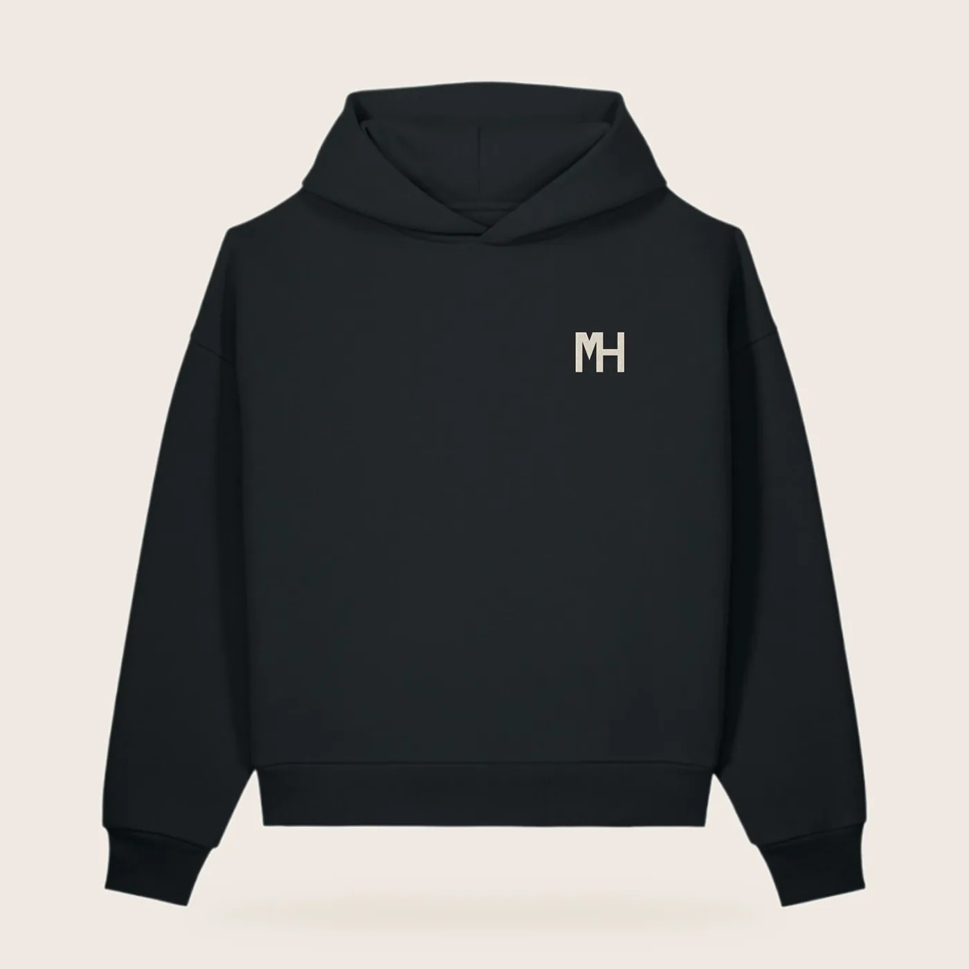 MH Essential Hoodie, black, front view, with a small cream MH monogram at the left chest